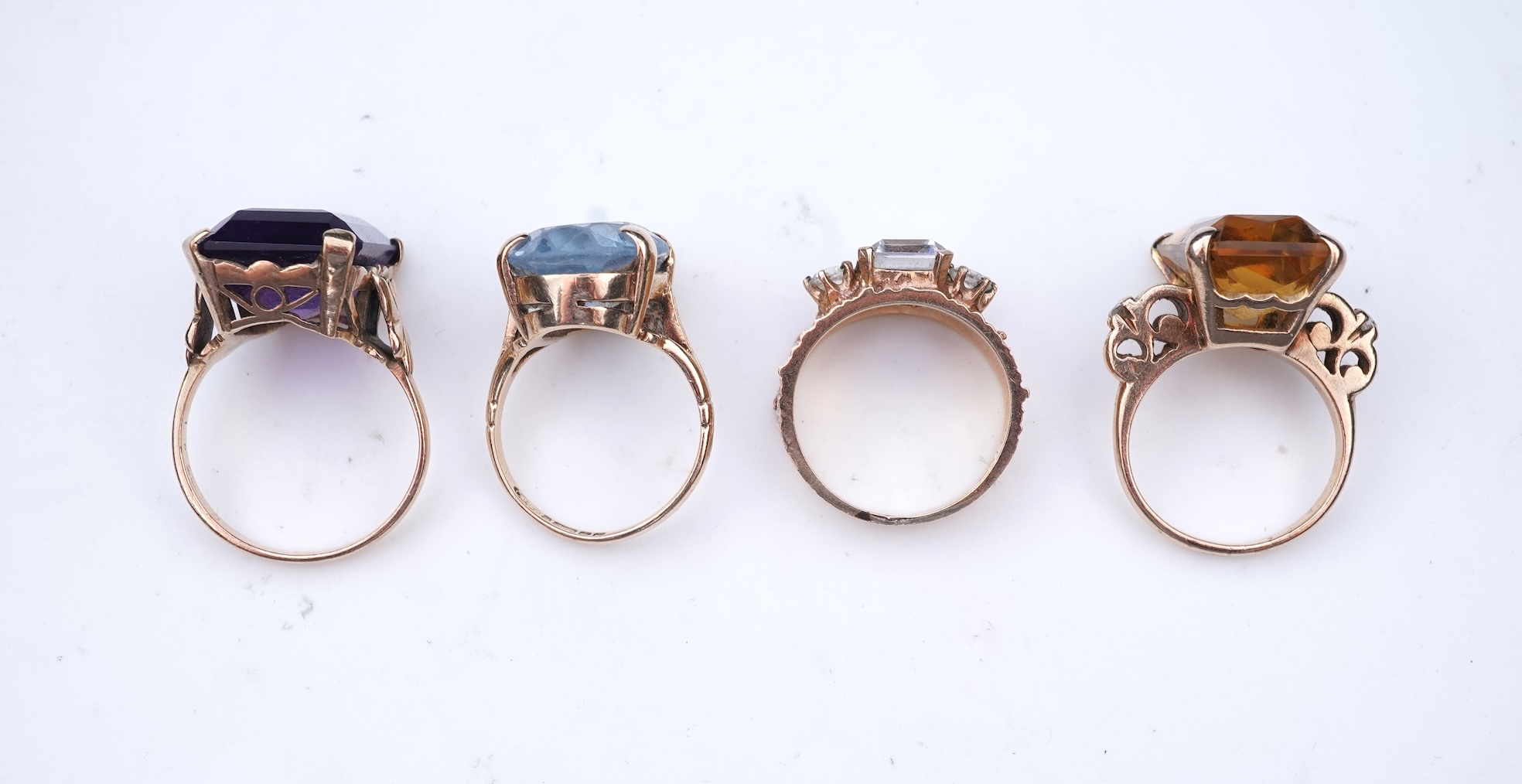 Four gem-set rings
